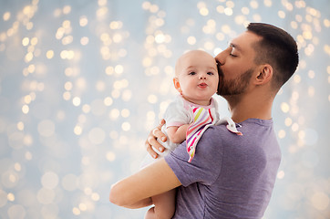 Image showing father kissing little baby daughter