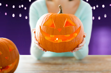 Image showing close up of woman with halloween pumpkin