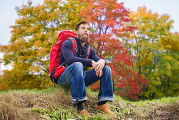 Image showing man with backpack hiking in autumn