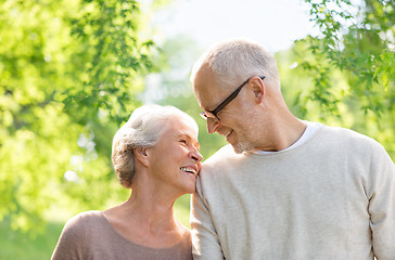 Image showing happy senior couple over green natural background