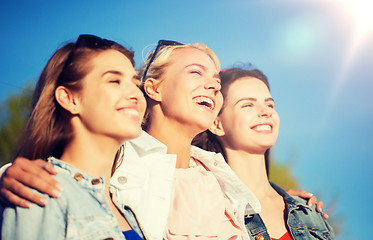 Image showing happy women or teenage girls hugging outdoors