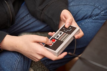 Image showing Playing an old gaming console