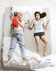 Image showing Top view of happy family with one newborn child in bedroom.