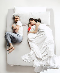 Image showing Top view of happy family with one newborn child in bedroom.