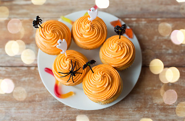 Image showing halloween party cupcakes with decorations on plate