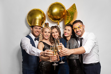 Image showing happy friends clinking champagne glasses at party