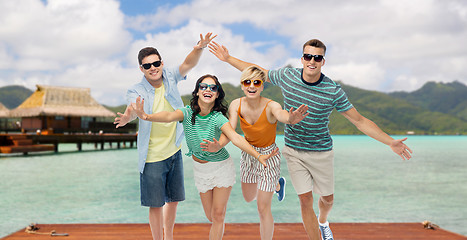 Image showing friends in sunglasses having fun over bora bora