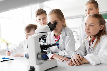 Image showing kids or students with microscope biology at school