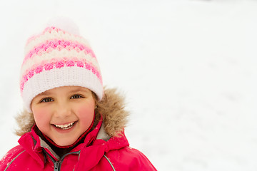 Image showing happy little girl in winter clothes outdoors