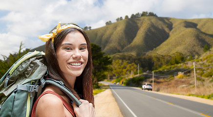 Image showing happy woman with backpack hiking over big sur