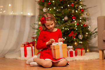 Image showing girl with christmas gift at home
