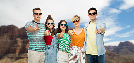 Image showing friends pointing at you over grand canyon