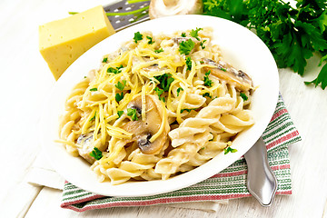 Image showing Fusilli with mushrooms on board