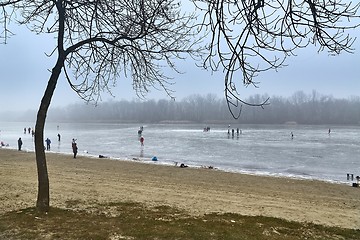 Image showing Skating on frozen lake