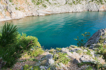 Image showing Rocky beach, transparent blue sea