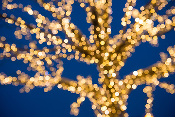 Image showing Blurred golden lights Christmas Tree