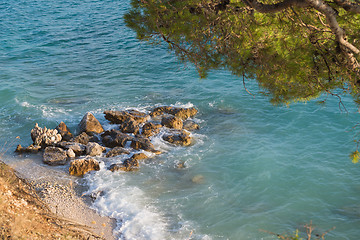 Image showing Rocky beach, blue sea