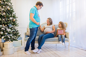 Image showing Beautiful pregnant woman sitting with doughter and husband