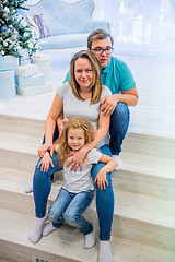 Image showing Family portrait near christmas tree