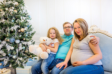 Image showing Family portrait near christmas tree