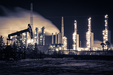 Image showing Pump jack and refinery at night.