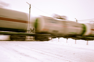 Image showing Train with oil tanks moving.