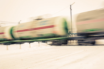 Image showing Train with oil tanks moving.