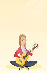 Image showing Woman playing the acoustic guitar.