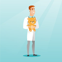Image showing Pediatrician doctor holding teddy bear.