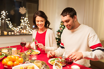 Image showing happy couple eating at christmas dinner