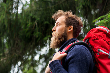 Image showing bearded traveler with backpack in woods