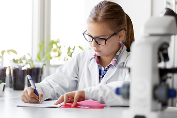 Image showing girl studying chemistry at school laboratory