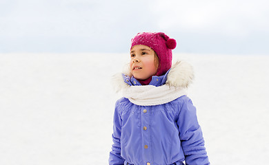 Image showing happy little girl in winter clothes outdoors