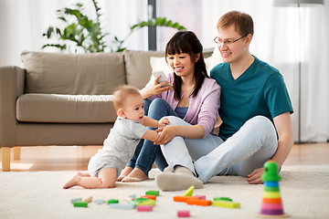 Image showing happy family with baby boy at home