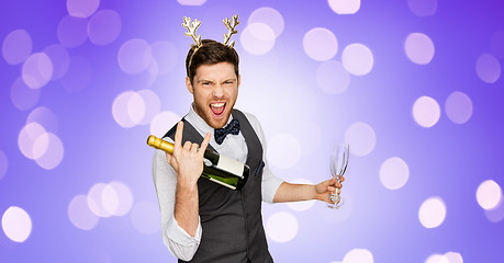 Image showing man with bottle of champagne at christmas party