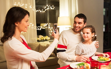 Image showing happy family taking picture at christmas dinner