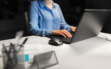 Image showing close up of female hands with laptop and mouse