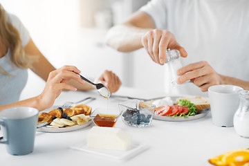 Image showing close up of couple having breakfast at home
