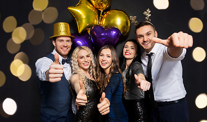 Image showing friends at christmas party showing thumbs up