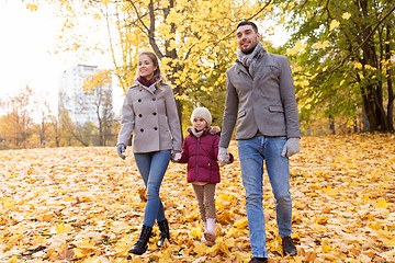 Image showing happy family walking at autumn park