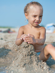 Image showing Little girl on sandy beach