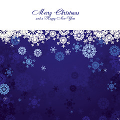 Image showing Blue christmas background with snowflakes and wish of Merry Christmas