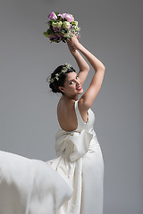 Image showing bride with a bouquet  isolated on white background