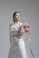 Image showing bride with a bouquet  isolated on white background