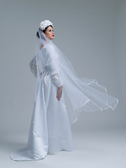Image showing young bride in a wedding dress with a veil