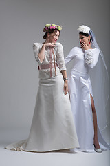 Image showing Portrait of two beautiful young bride in wedding dresses