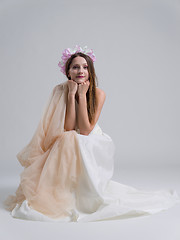 Image showing young bride sitting in a wedding dress