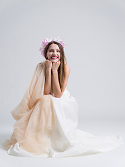 Image showing young bride sitting in a wedding dress