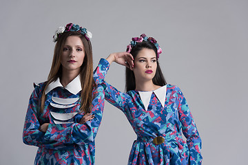 Image showing two Fashion Model girls isolated over white background