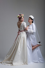 Image showing Portrait of two beautiful young bride in wedding dresses